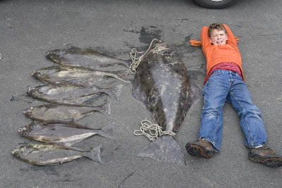 Here's my then 11 y/o with a 95lb fish he caught and a few others from that day.