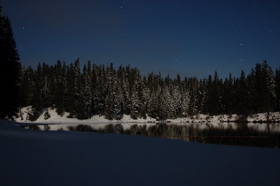 A pictue of the lake at 1 AM in the morning, stars in the back ground and full moon behind me.  I set my camera on Nice-divers's hat on the snow bank.  It was a beautifull night.